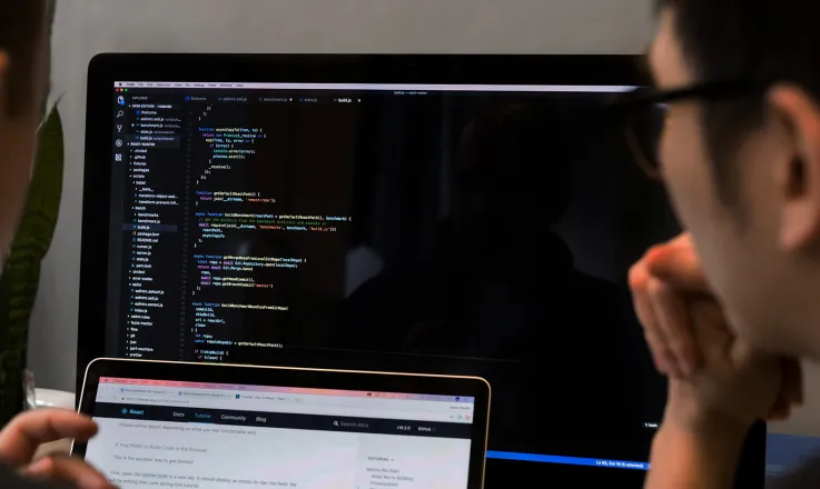 Developers reviewing React code